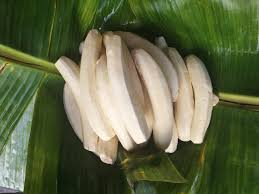 Peeled matooke arranged neatly on a Banana leaf